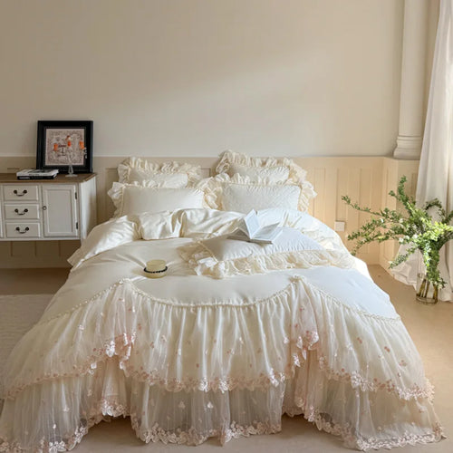 Ivory cottagecore bedding with a heart-quilted cotton duvet cover, tiered lace ruffles, and delicate floral embroidery – L&B