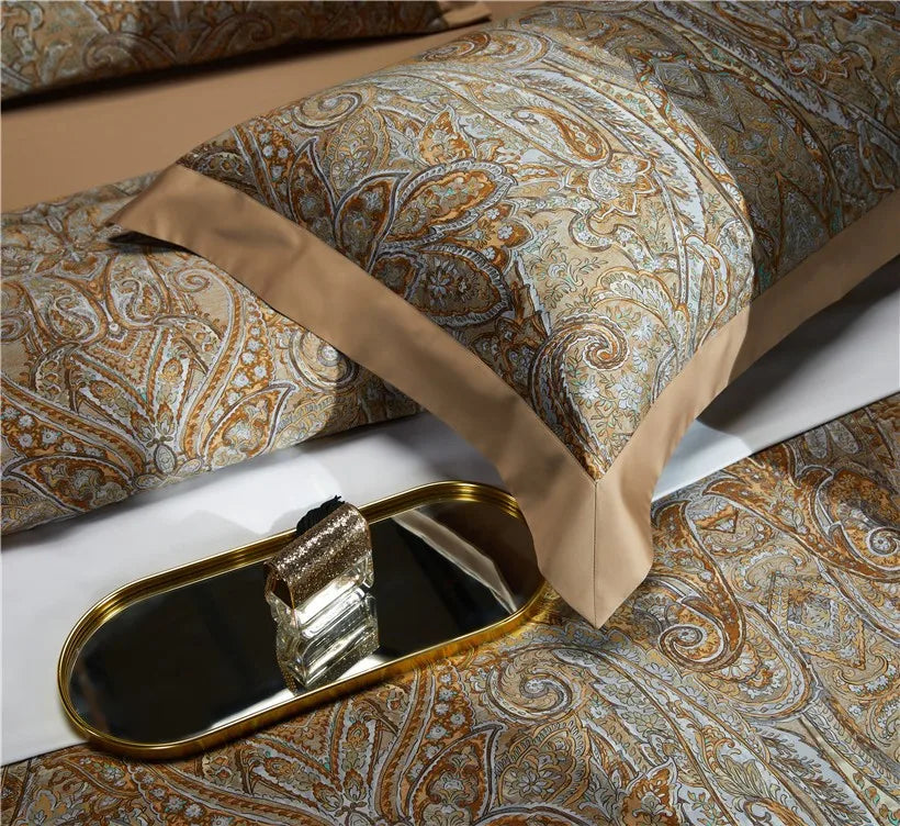 Close-up of layered gold and pale blue baroque pillow shams, ZLIKAN – L&B