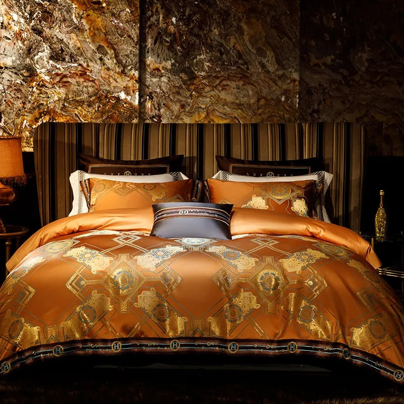 Luxury orange duvet cover set displayed with symmetrical gold baroque motifs and coordinating shams – ROYAL H. ORANGE – L&B