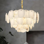 Close-up of a glowing natural alabaster petal chandelier with irregular raw edges - L&B