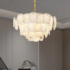 Layered alabaster statement chandelier in a contemporary living room with warm wood accents - L&B