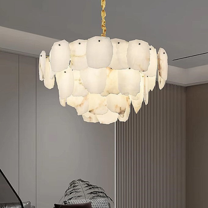 Layered alabaster statement chandelier in a contemporary living room with warm wood accents - L&B
