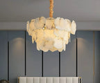 Alabaster petal chandelier for bedroom interiors with layered raw-edge stone panels and a warm glow - L&B