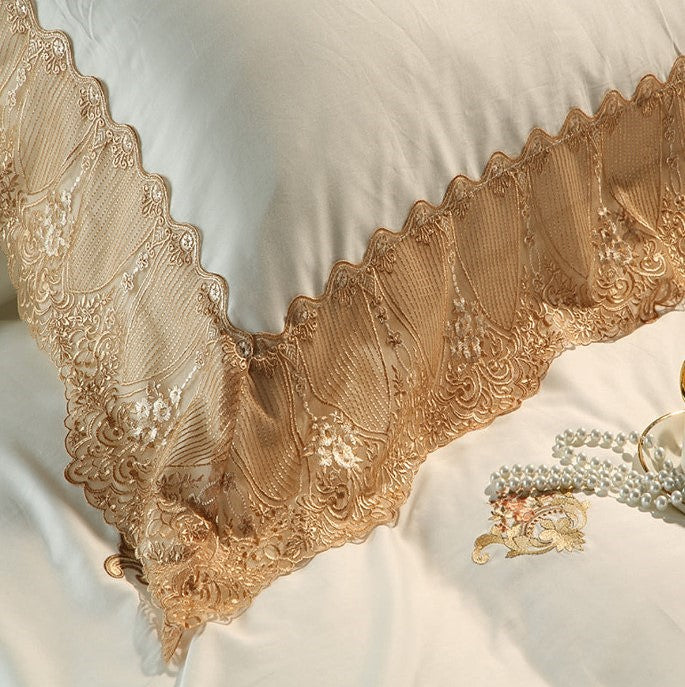 Champagne gold lace border close-up on an ivory Egyptian cotton duvet cover, STONGE ROYAL – L&B