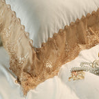 Champagne gold lace border close-up on an ivory Egyptian cotton duvet cover, STONGE ROYAL – L&B