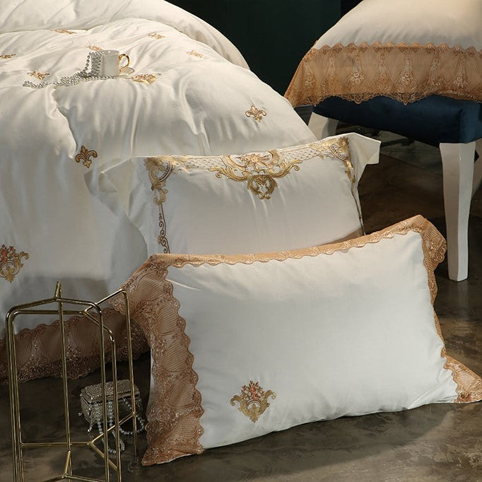 Layered ivory pillow shams with gold floral embroidery and scalloped trim, STONGE ROYAL – L&B
