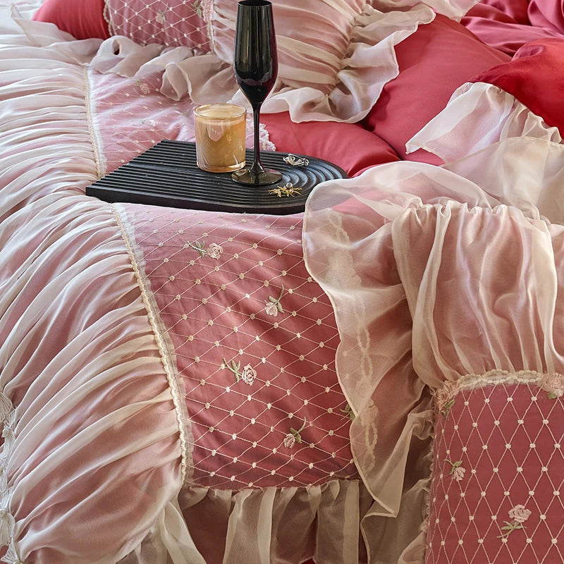 Close view of red and pink heart-quilted bedding with romantic lace trim, RUBYLACE RED – L&B