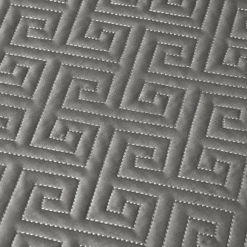 Close-up of pewter gray labyrinth-pattern quilted bedspread texture, LUSTRA PEWTER – L&B