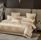 Luxury gold bedding set styled with a damask jacquard duvet cover and coordinating champagne gold pillows - L&B