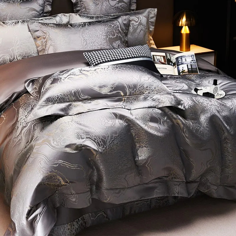 Charcoal gray duvet cover set with a lustrous jacquard pattern and matching shams on a modern luxury bed – L&B