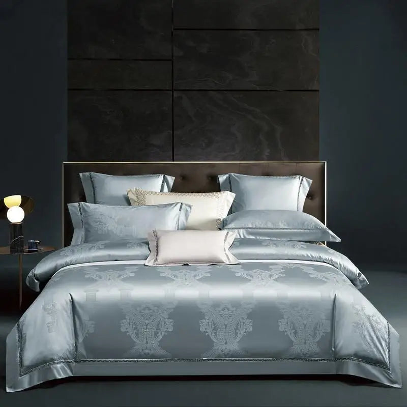Sky blue damask duvet cover set with coordinating shams and decorative pillows in a modern luxury bedroom – L&B