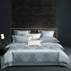 Sky blue damask duvet cover set with coordinating shams and decorative pillows in a modern luxury bedroom – L&B