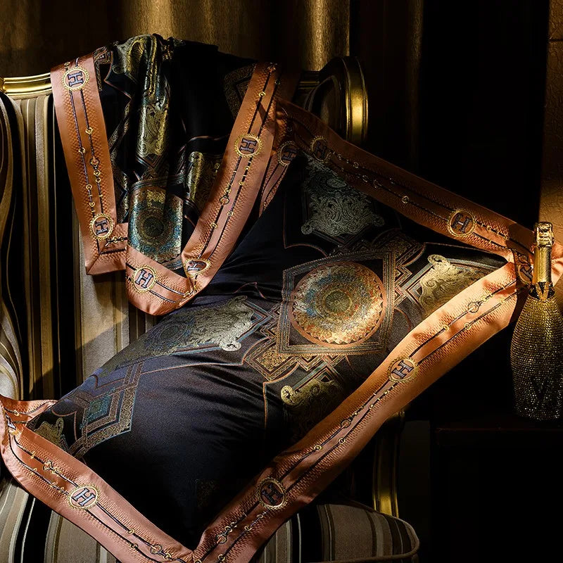 Black and gold Egyptian cotton bedding draped to reveal the lustrous satin reverse and ornate border – ROYAL H. BLACK – L&B
