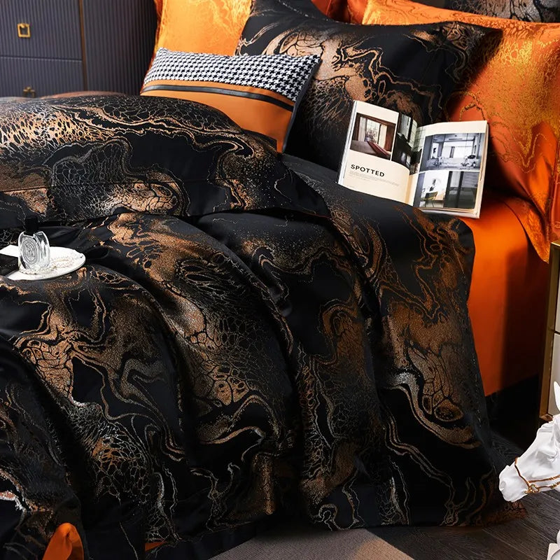 Luxury black and gold duvet cover set styled with layered shams, burnt orange pillows, and elegant bedside details – L&B