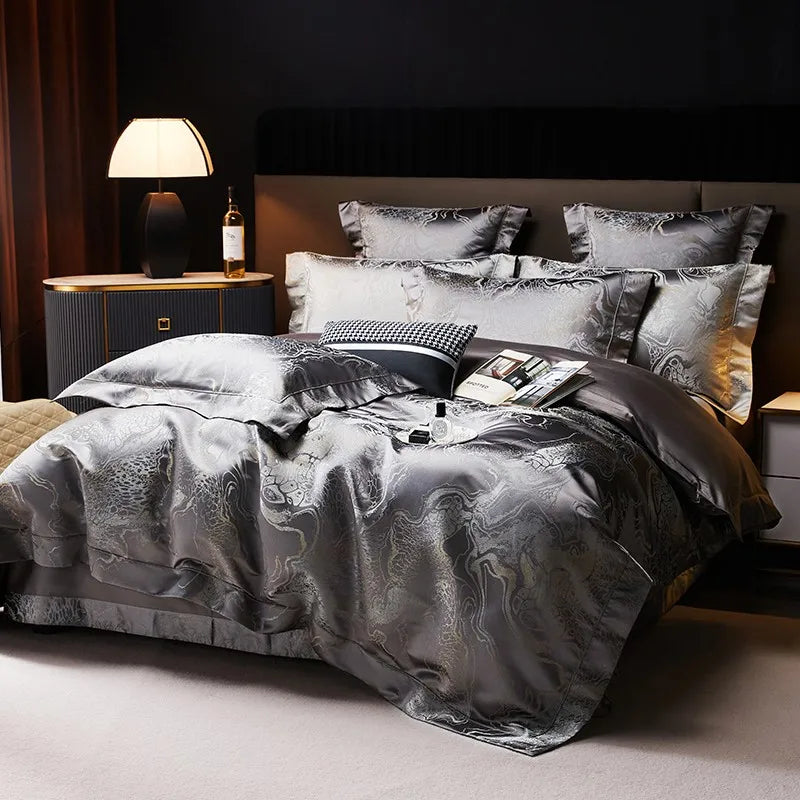 Dark gray luxury bedding set styled with an intricate jacquard duvet cover and coordinating decorative pillow shams – L&B
