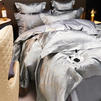 Silver grey duvet cover set with metallic jacquard detailing and coordinating shams on an elegantly styled bed – L&B