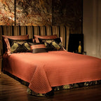 Textured copper quilted bedspread styled with black and gold baroque pillow shams – ROYAL H. BLACK – L&B