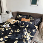 Black and gold leaf duvet cover set styled with coordinating pillows and beige reverse – L&B