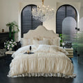 Ivory princess ruffled lace duvet cover and bed skirt set, RUBYLACE IVORY styled in an elegant bedroom – L&B