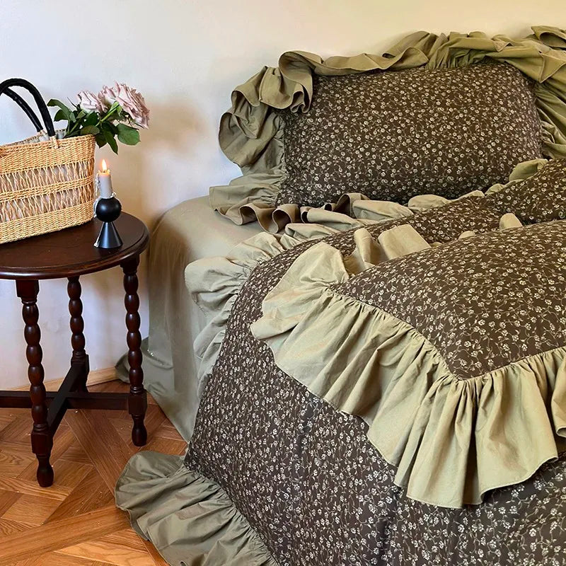 Olive green cottagecore duvet cover set with floral print and cascading ruffles, side view of MOSSBELLE – L&B
