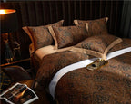 Luxury brown paisley Egyptian cotton bedding shown from an angled bedside view, ZUVRIC – L&B
