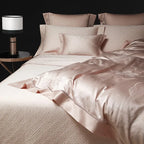 Blush pink jacquard bedding layered with matching quilted bedspread and pillow shams, LUSTRA BLUSH – L&B