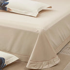 Ivory Egyptian cotton bed sheet with a smooth drape and refined tailored edge from the embroidered bedding set – L&B