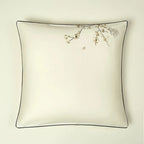 Ivory Egyptian cotton pillow sham with delicate blue botanical embroidery and refined gray piping – L&B