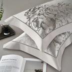 Silver gray floral jacquard pillow shams layered with satin bedding, SILVIORA – L&B