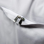 Close-up of the concealed zipper closure on the smooth silver-gray Egyptian cotton reverse of the duvet cover – L&B