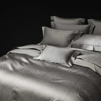 Pewter gray geometric jacquard bedding with sculptural contour linework, LUSTRA PEWTER – L&B
