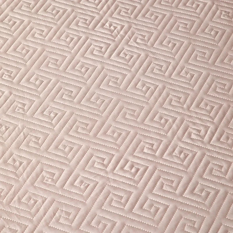 Close-up of blush pink geometric quilted bedspread texture from the LUSTRA BLUSH bedding set – L&B