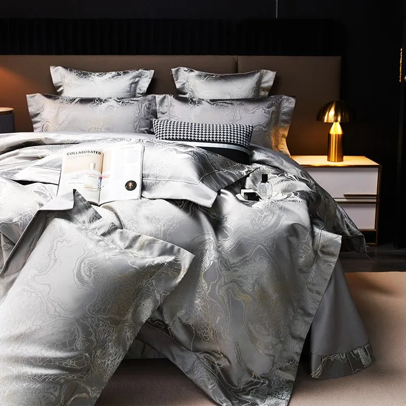 Luxury silver duvet cover set with dragon and cloud-inspired jacquard motifs, matching shams, and a graceful drape – L&B