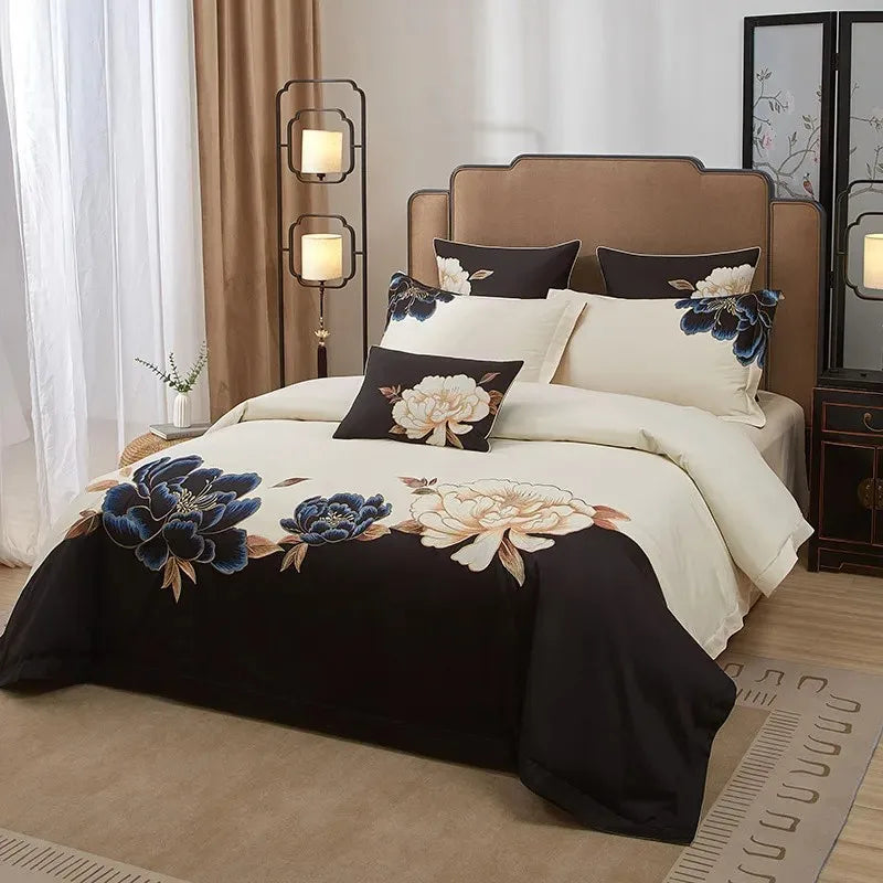 Embroidered Egyptian cotton bedding set with a black floral duvet cover, ivory sheets, and matching decorative pillows – L&B