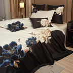 Black and ivory embroidered duvet cover set styled with blue floral detailing and coordinating pillow shams – L&B